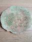 50. Centrotavola in terra rossa con engobbio verde e cristallina, diametro cm 23 - 35 euro